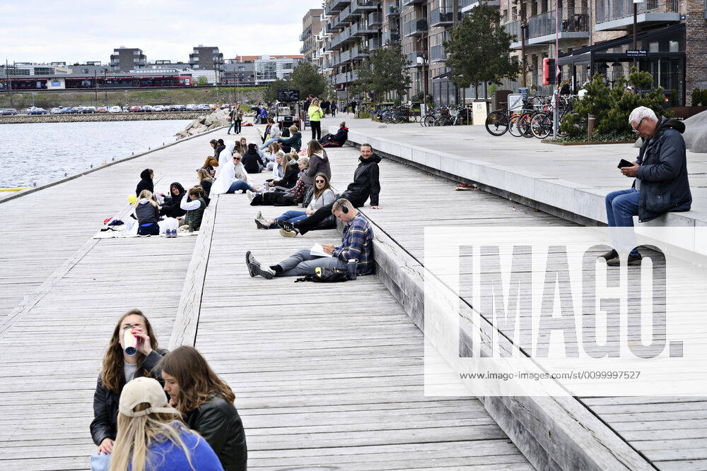 The Copenhageners enjoy the spring sun at Gothenburg Square and Sandkaj in Nordhavnen in Copenhagen on Sunday, April 26, 2020 There is a ban on more than ten people because of the danger of contagion with coronavirus covid 19 perceived less than it really is , Copenhagen Denmark,