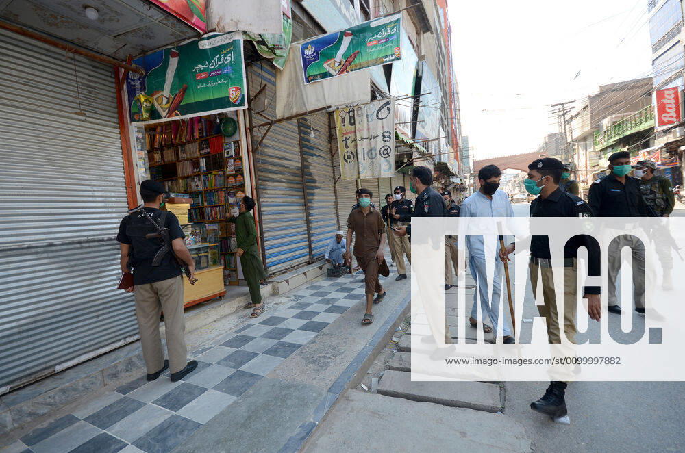 Pakistan: Police officials closing shops Police officials closing shops in the city for precautionary measures to prevent corona virus. Authorities appealed for people to avoid public gatherings to curb the spread of the corona virus and close shops until four o clock in the month of Ramadan. Peshawar Khyber Pakhtunkhwa Pakistan
