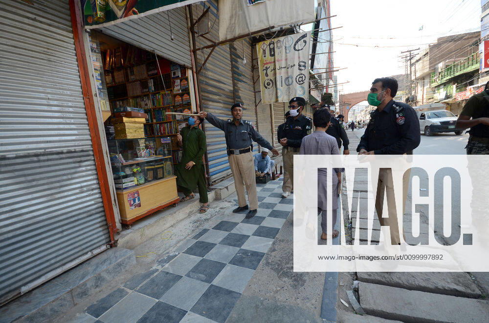 Pakistan: Police officials closing shops Police officials closing shops in the city for precautionary measures to prevent corona virus. Authorities appealed for people to avoid public gatherings to curb the spread of the corona virus and close shops until four o clock in the month of Ramadan. Peshawar Khyber Pakhtunkhwa Pakistan