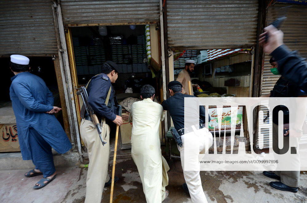 Pakistan: Police officials closing shops Police officials closing shops in the city for precautionary measures to prevent corona virus. Authorities appealed for people to avoid public gatherings to curb the spread of the corona virus and close shops until four o clock in the month of Ramadan. Peshawar Khyber Pakhtunkhwa Pakistan