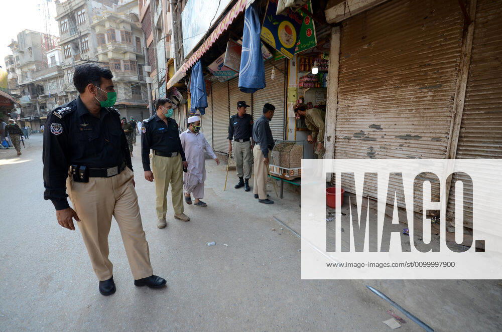 Pakistan: Police officials closing shops Police officials closing shops in the city for precautionary measures to prevent corona virus. Authorities appealed for people to avoid public gatherings to curb the spread of the corona virus and close shops until four o clock in the month of Ramadan. Peshawar Khyber Pakhtunkhwa Pakistan