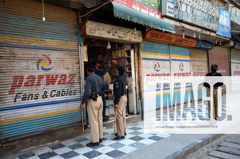 Pakistan: Police officials closing shops Police officials closing shops in the city for precautionary measures to prevent corona virus. Authorities appealed for people to avoid public gatherings to curb the spread of the corona virus and close shops until four o clock in the month of Ramadan. Peshawar Khyber Pakhtunkhwa Pakistan