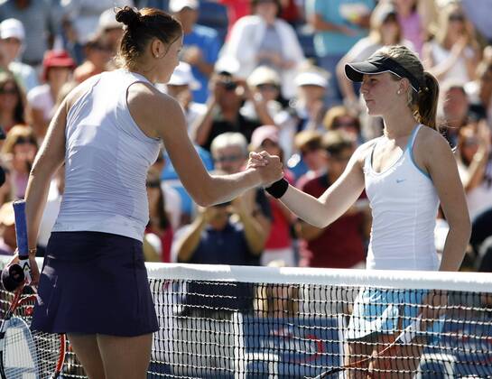 Number 1 seed Dinara Safina and Olivia Rogowska (R) shake hands after their first round match at the US Open  NYP20090901124