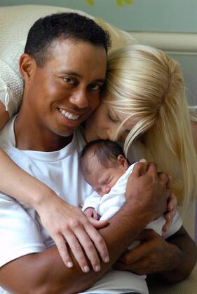 Jun 27, 2007 - Miami, FL, USA - TIGER WOODS (L) and ELIN WOODS with their new daughter, SAM ALEXIS WOODS - at a private residence in Florida on June 23, 2007. The world s top-ranked golfer became a father for the first time, one day after tying for second at the US Open. His wife, Swedish model Elin Nordegren, gave birth to the girl, named Sam Alexis Woods. Now, Tiger Woods new-born daughter has appeared in front of the cameras for the first time, and Woods has released photos on his website. PICTURED: Tiger Woods and Elin Woods with their daughter, Sam Alexis Woods. - ZUMAz03 o0 USA