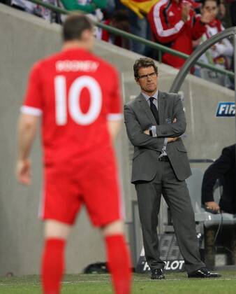England s Fabio Capello watches Wayne Rooney - FIFA World Cup 2010 Round of 16 Germany v England (red) - 27th June, 2010 - EDITORIAL USE ONLY. No use with unauthorised audio, video, data, fixture lists, club league logos or live services. Online in-match use limited to 120 images, no video emulation. No use in betting, games or single club league player publications.