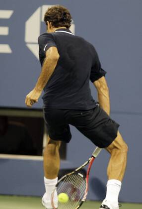 Roger Federer of the SUI hits a ball between his legs and wins the point in the second set  NYP20100830127