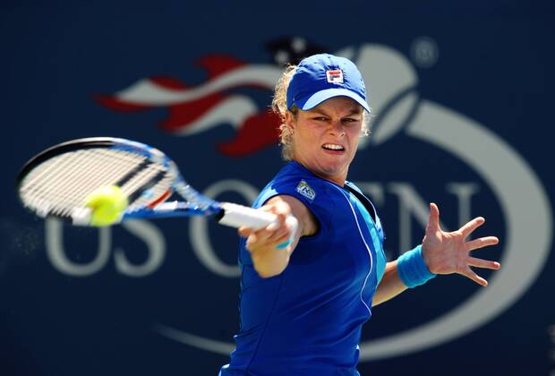 Kim Clijsters of Belgium returns the ball 