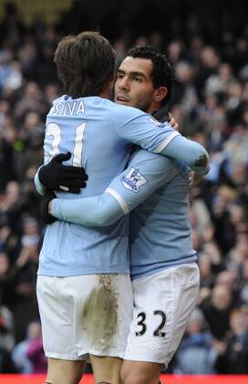 Carlos Tevez of Manchester City (R) celebrates scoring third goal - FA Cup 4th Round replay Manchester City - Notts County - EDITORIAL USE ONLY. No use with unauthorised audio, video, data, fixture lists, club league logos or live services. Online in-match use limited to 120 images, no video emulation. No use in betting, games or single club league player publications.