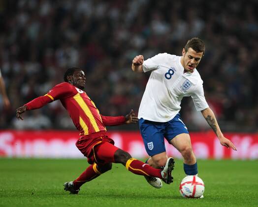 Jack Wilshere of England gets tackled by Anthony Annan of Ghana - Friendly England (white) v Ghana 29th March, 2011 EDITORIAL USE ONLY. No use with unauthorised audio, video, data, fixture lists, club league logos or live services. Online in-match use limited to 120 images, no video emulation. No use in betting, games or single club league player publications.