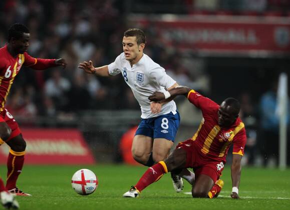 Jack Wilshere of England gets tackled by Emmanuel Agyemang-Badu of Ghana - Friendly England (white) v Ghana 29th March, 2011 EDITORIAL USE ONLY. No use with unauthorised audio, video, data, fixture lists, club league logos or live services. Online in-match use limited to 120 images, no video emulation. No use in betting, games or single club league player publications.