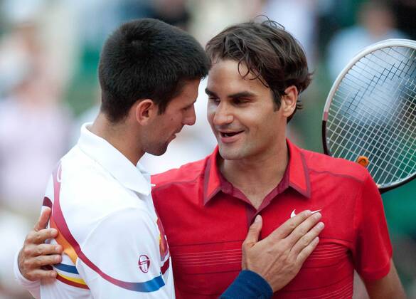 PARIS, June 3, 2011 -- Roger Federer (R) of Switzerland and Novak Djokovic of Serbia greet each other after the men s singles semifinal match at the French Open tennis tournament at the Roland Garros stadium in Paris, capital of France, June 3, 2011. Federer won the match 3-1. (Xinhua Bai Xue) FRANCE-PARIS-TENNIS-FRENCH OPEN-SEMIFINAL 