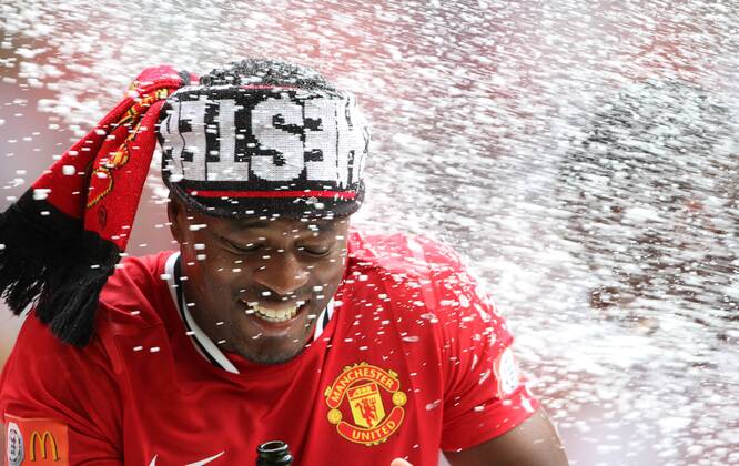 Manchester Uniteds Patrice Evra celebrates - Community Shield - 7th August, 2011 EDITORIAL USE ONLY. No use with unauthorised audio, video, data, fixture lists, club league logos or live services. Online in-match use limited to 120 images, no video emulation. No use in betting, games or single club league player publications. Supercup Super Cup