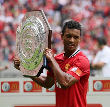 Manchester United ManUs Nani celebrates with the trophy Community Shield Manchester City v Manchester United ManU 7th August, 2011 EDITORIAL USE ONLY. No use with unauthorised audio, video, data, fixture lists, club league logos or live services. Online in-match use limited to 120 images, no video emulation. No use in betting, games or single club league player publications. o0 Sieg Siegerehrung Objekte Pokal Trophäe