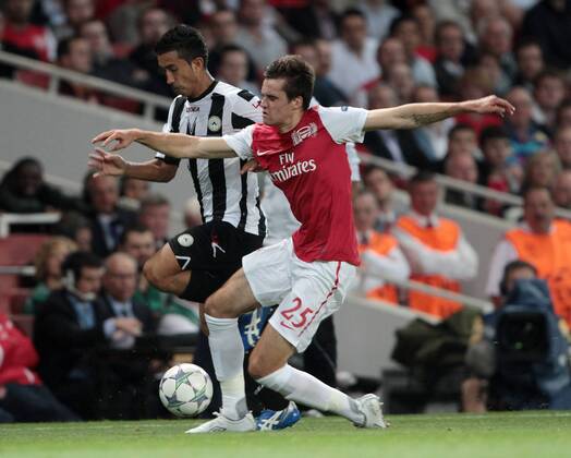 Arsenals Carl Jenkinson tussles with Udineses Giampero Pinzi UEFA Champions League Qualifying Arsenal FC London vs Udinese Calcio 16th August, 2011 EDITORIAL USE ONLY. No use with unauthorised audio, video, data, fixture lists, club league logos or live services. Online in-match use limited to 120 images, no video emulation. No use in betting, games or single club league player publications.