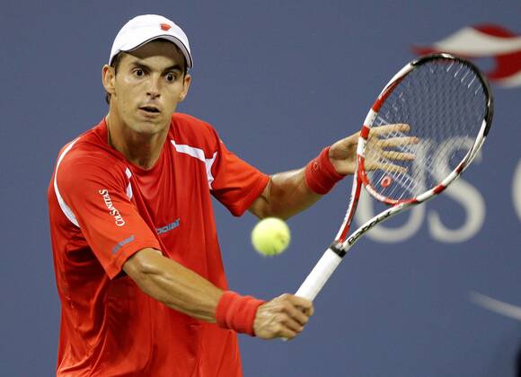 Santiago Giraldo of Colombia hits backhand in his match on day in Arthur Ashe Stadium at the U.S. Open Tennis Championships Stadium at the Billie Jean King National Tennis Center in New York City on August 29, 2011.  NYP20110829137