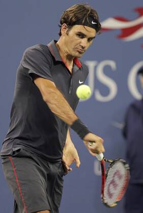 Roger Federer of Switzerland hits backhand in his match on day in Arthur Ashe Stadium at the U.S. Open Tennis Championships Stadium at the Billie Jean King National Tennis Center in New York City on August 29, 2011.  NYP20110829140