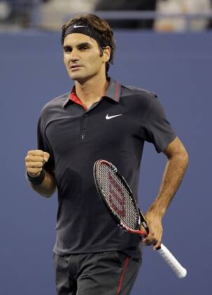 Roger Federer of Switzerland pumps his fist after match point in his straight sets victory on day in Arthur Ashe Stadium at the U.S. Open Tennis Championships Stadium at the Billie Jean King National Tennis Center in New York City on August 29, 2011.  NYP20110829141