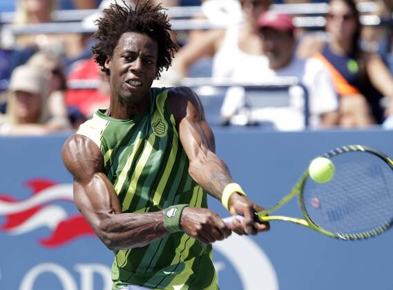 Gael Monfils of France his a backhand in his match on day 4 in Louis Armstrong Stadium at the U.S. Open Tennis Championships Stadium at the Billie Jean King National Tennis Center in New York City on September 1, 2011.  NYP20110901112