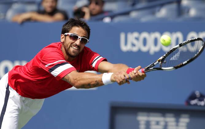 Janko Tipsarevic of Serbia reaches to return a serve on day 8 in Louis Armstrong Stadium at the U.S. Open Tennis Championships at the Billie Jean King National Tennis Center in New York City on September 5, 2011.  NYP20110905110