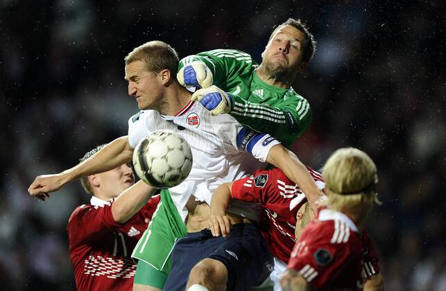 Soccer National Team EURO Qualification match, Denmark - Norway: Brede Hangeland, Norge. Keeper Thomas Sörensen, Danmark. 