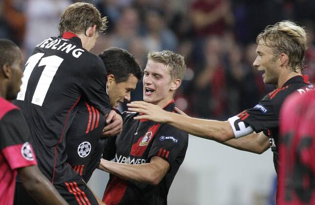 Leverkusen s Michael BALLACK (M) celebrates scoring the 2:0 with teammates Stefan Kiessling (L), Lars Bender (2.R) and Simon Rolfes during the Championsleague match between Bayer 04 Leverkusen and KRC Genk, Bayarena in Leverkusen on September 28., 2011. Bayer 04 Leverkusen gegen KRC Genk am 2. Spieltag der Championsleague in der Saison 2011 2012 am 28. September 2011.