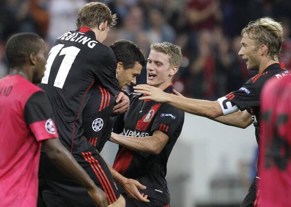 Leverkusen s Michael BALLACK (M) celebrates scoring the 2:0 with teammates Stefan Kiessling (L), Lars Bender (2.R) and Simon Rolfes during the Championsleague match between Bayer 04 Leverkusen and KRC Genk, Bayarena in Leverkusen on September 28., 2011. Bayer 04 Leverkusen gegen KRC Genk am 2. Spieltag der Championsleague in der Saison 2011 2012 am 28. September 2011.