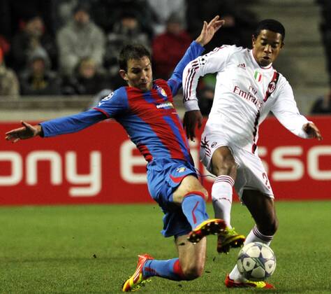 Marek Bakos of Viktoria (left) and Urby Emanuelson during their final Champions League group H soccer match FC Viktoria Plzen vs AC Milan at Synot Tip Arena Eden stadium in Prague, Czech Republic, Tuesday, December 6, 2011. (CTKxPhoto VitxSimanek)  CTKPhoto032201112061028101