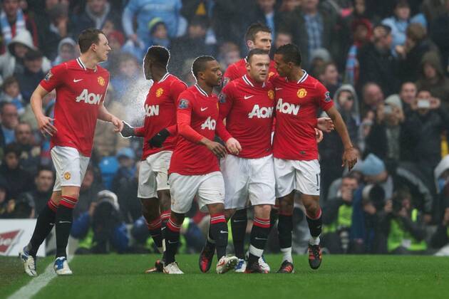 Manchester United s Wayne Rooney celebrates scoring the first goal against Manchester City s goalkeeper Costel Pantilimon during the FA Cup 3rd Round match at the City of Manchester Stadium. xHOCHxZWEIx xPropagandax