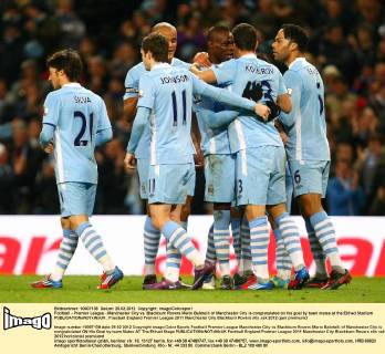 Football - Premier League - Manchester City vs. Blackburn Rovers Mario Balotelli of Manchester City is congratulated on his goal by team mates at the Etihad Stadium 