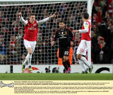 Laurent Koscielny (L) of Arsenal celebrates after scoring during the UEFA Champions League match against AC Milan in London, Britain, March 6, 2012. Arsenal won 3-0. (Xinhua Tang Shi) (jyc) BRITAIN-LONDON-UEFA CHAMPIONS LEAGUE-ARSENAL VS AC MILAN