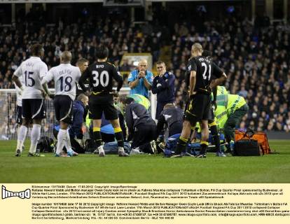 Referee Howard Webb and Bolton manager Owen Coyle look on in shock as Fabrice Muamba collapses Tottenham v Bolton, FA Cup Quarter Final sponsored by Budweiser, at White Hart Lane, London. 17th March 2012 EDITORIAL USE ONLY. No use with unauthorised audio, video, data, fixture lists, club league logos or live services. Online in-match use limited to 120 images, no video emulation. No use in betting, games or single club league player publications.