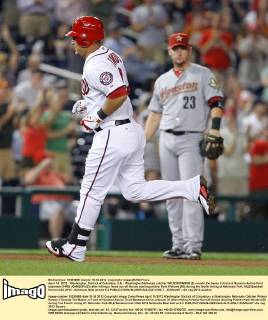 April 16, 2012 - Washington, District of Columbia, U.S. - Washington Nationals catcher WILSON RAMOS (3) rounds the bases in front of Houston Astros third baseman CHRIS JOHNSON (23) after hitting a home run off Astros starting pitcher Kyle Weiland (56) during the fourth inning at Nationals Park. MLB Baseball Herren USA 2012 - Nationals Beat Astros 6-3 - ZUMAm67