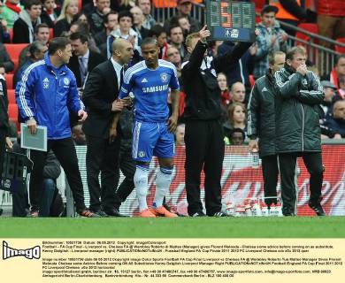 Football - FA Cup Final - Liverpool vs. Chelsea FA @ Wembley Roberto di Matteo (Manager) gives Florent Malouda - Chelsea some advice before coming on as substitute. Kenny Dalglish - Liverpool manager (right)