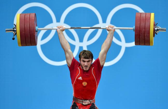 LONDON, Aug. 3, 2012 - Apti Aukhadov of Russia competes during men s 85kg weightlifting event at London 2012 Olympic Games, London, Britain, Aug. 3, 2012. Apti Aukhadov of Russia claimed the silver medal of the event. (Xinhua Gong Lei) (OLY2012)BRITAIN-LONDON-WEIGHTLIFTING-MEN-85KG 