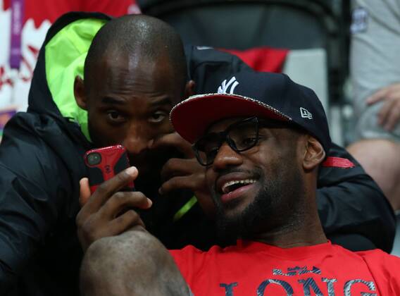 (120807) -- LONDON, Aug. 7, 2012 (Xinhua) -- Lebron James and Kobe Bryant of USA basketball team are picutured during women s basketball quarterfinal match between USA and Canada at London 2012 Olympic Games in London, Britain, on August 7, 2012. USA won 91-48. (Xinhua Meng Yongmin) (nxl) (OLY2012)BRITAIN-LONDON-BASKETBALL-WOMEN 