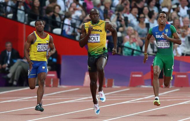 OLYMPIA - Olympische Spiele 2012 LONDON,ENGLAND,08.AUG.12 - DIVERS, OLYMPIA, LEICHTATHLETIK, LAUFSPORT - Olympische Sommerspiele in London 2012, 200m, Herren. Bild zeigt Alex Quinonez (ECU), Usain Bolt (JAM) und Aldemir Da Silva Junior (BRA).