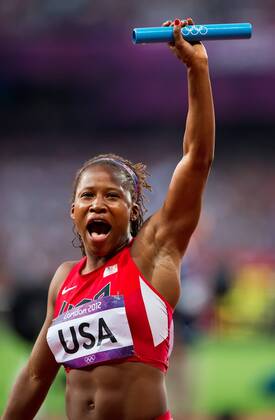 London, GBR - Lauryn Williams of the United States acknowledged the cheers of the crowd following the USA s 4 X 100m relay during heat 1 of the event at Olympic Stadium during the 2012 Summer Olympic Games in London, England, Thursday, August 9, 2012. The United States team qualified by finishing first in a time of 41.64. 2012 Summer Olympics Women s Relay - ZUMAm67