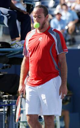 Xavier Malisse of Belgium bits the tennis ball after losing a tiebreaker point in the fourth set during first-round action at the 2012 U.S. Open held at the National Tennis Center on August 29, 2012 in New York. UPI Photo Monika Graff  NYP20120829329