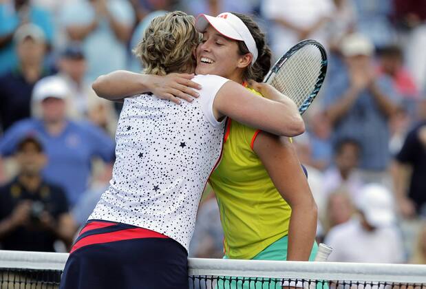 Kim Clijsters of Belgium hugs Laura Robson of Great Britain after her second round defeat at the 2012 U.S. Open Tennis Championships in Arthur Ashe Stadium at the Billie Jean King National Tennis Center in New York City on August 29, 2012.  NYP20120829120