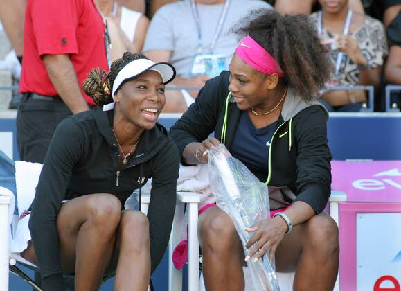 Venus Williams (L) and her sister Serena, USA, chat before the start of their women s double match at the 2012 U.S. Open held at the National Tennis Center on August 29, 2012 in New York. UPI Photo Monika Graff  NYP20120829333