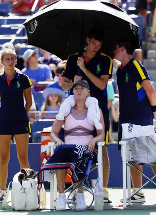 Maria Sharapova of Russia ices her neck during a change over in her match against Mallory Burdette in Arthur Ashe Stadium at the Billie Jean King National Tennis Center in New York City on August 31, 2012. Sharapova defeated Burdette 6-1, 6-1.  NYP20120831142