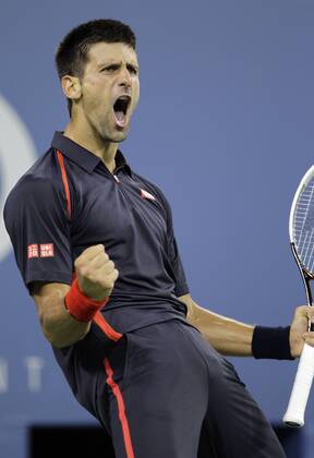 Novak Djokovic of Serbia reacts after winning a point in the second set in his quarterfinal match on day 11 in Arthur Ashe Stadium at the BillieJeanKing National Tennis Center in New York City on September 6, 2012.  NYP20120906149