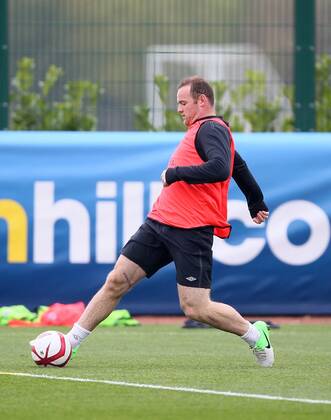 England s Wayne Rooney shows off his scarred leg during training..England Training - London Colney- 11 10 12 - Picture David Klein Sportimage EDITORIAL USE ONLY. No use with unauthorised audio, video, data, fixture lists, club league logos or live services. Online in-match use limited to 120 images, no video emulation. No use in betting, games or single club league player publications.