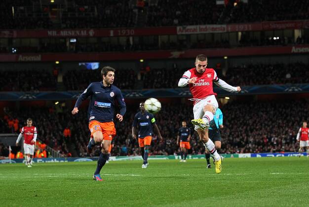 Arsenal s Lukas Podolski scoring his sides second goal. FC Arsenal London v HSC Montpellier -Champions League- Emirates Stadium,London- 21 11 12 - Picture DavidxKlein Sportimage EDITORIAL USE ONLY. No use with unauthorised audio, video, data, fixture lists, club league logos or live services. Online in-match use limited to 120 images, no video emulation. No use in betting, games or single club league player publications.