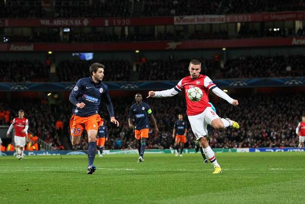Arsenal s Lukas Podolski scoring his sides second goal. FC Arsenal London v HSC Montpellier -Champions League- Emirates Stadium, London- 21 11 12 - Picture DavidxKlein Sportimage EDITORIAL USE ONLY. No use with unauthorised audio, video, data, fixture lists, club league logos or live services. Online in-match use limited to 120 images, no video emulation. No use in betting, games or single club league player publications.