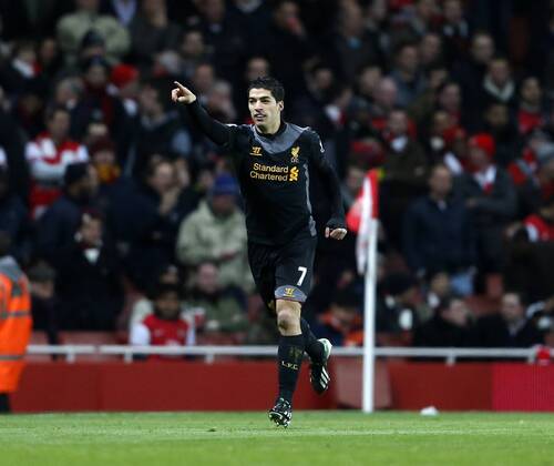 Liverpool s Luis Suarez celebrates scoring his sides opening goal.. - FC Arsenal vs FC Liverpool - Barclays Premier League - Emirates Stadium, London- 30 01 13 - EDITORIAL USE ONLY. No use with unauthorised audio, video, data, fixture lists, club league logos or live services. Online in-match use limited to 120 images, no video emulation. No use in betting, games or single club league player publications.