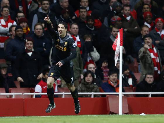 Liverpool s Luis Suarez celebrates scoring his sides opening goal.. - FC Arsenal vs FC Liverpool - Barclays Premier League - Emirates Stadium, London- 30 01 13 - EDITORIAL USE ONLY. No use with unauthorised audio, video, data, fixture lists, club league logos or live services. Online in-match use limited to 120 images, no video emulation. No use in betting, games or single club league player publications.