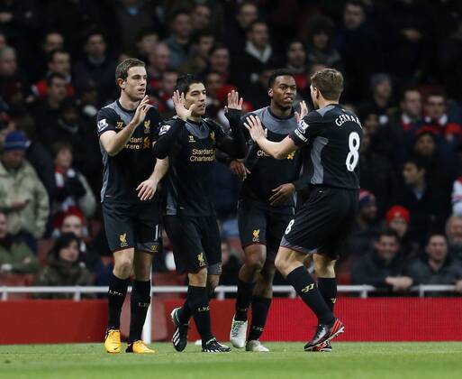 Liverpool s Luis Suarez celebrates scoring his sides opening goal.. - FC Arsenal vs FC Liverpool - Barclays Premier League - Emirates Stadium, London- 30 01 13 - EDITORIAL USE ONLY. No use with unauthorised audio, video, data, fixture lists, club league logos or live services. Online in-match use limited to 120 images, no video emulation. No use in betting, games or single club league player publications.