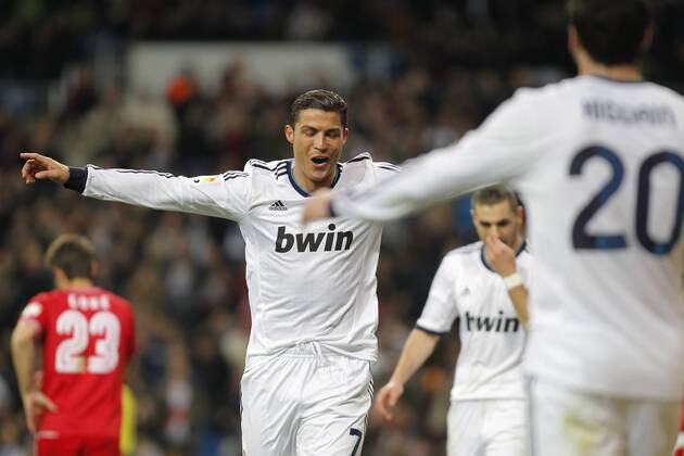 Madrid 09 02 2013. Football match between Real Madrid FC and FC Sevilla corresponding to the 23th day of the Spanish League, held at the Santiago Bernabeu stadium, in Madrid 02 09 2013. Cristiano Ronaldo celebrate his third goal after scoring