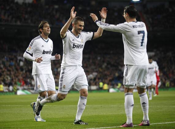 Madrid 09 02 2013. Football match between Real Madrid FC and FC Sevilla corresponding to the 23th day of the Spanish League, held at the Santiago Bernabeu stadium, in Madrid 02 09 2013. Karim Benzema score and celebrate with Kaka and Cristiano Ronaldo